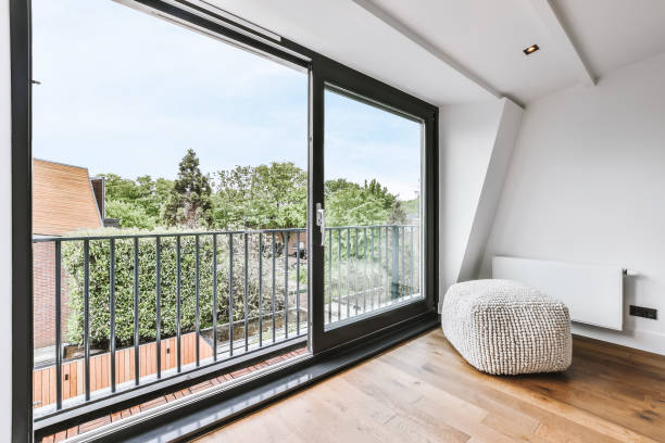 istock Stylish room with a huge window and an ottoman 1375668045