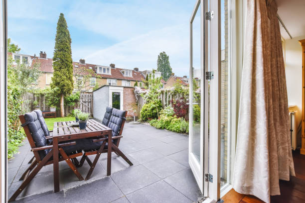 istock Delightful courtyard with wooden chairs 1375670602