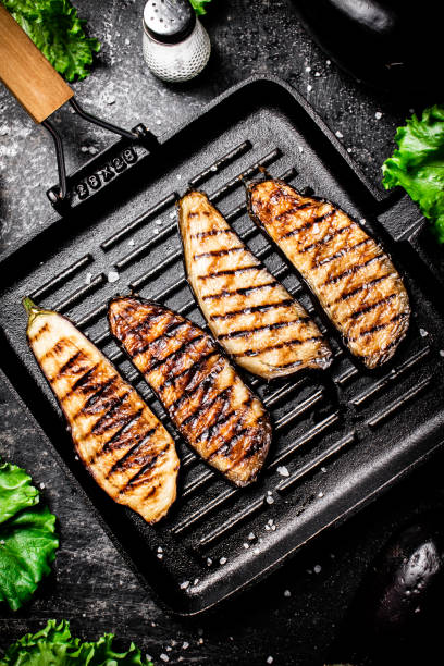 istock Slices of eggplant in a grill pan. 1375684581