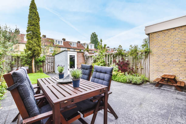 istock Delightful courtyard with wooden chairs 1375713211