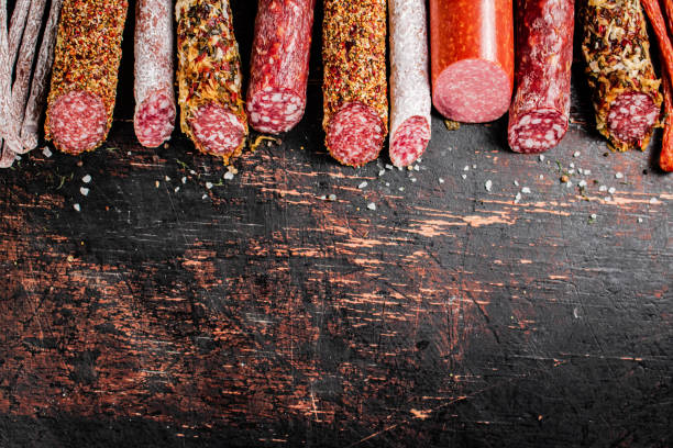 istock Various salami sausage on the table in a row. 1375718449