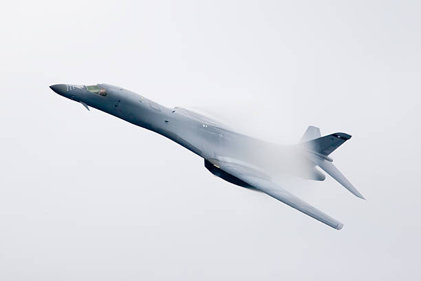 B1 Bomber A B1 Bomber flying through the clouds b1 bomber stock pictures, royalty-free photos & images