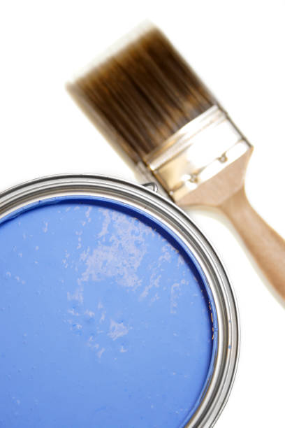 istock can of blue paint with brush in background isolated white 137572939