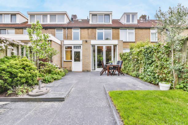 A delightful courtyard of the house with greenery and a beautifully laid stove