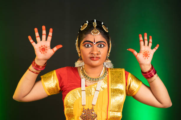 istock Young indian Bharatnatyam dancer performing anger posture or roudra rasa dance on stage - concept of Professional traditional Indian dancer 1375757577