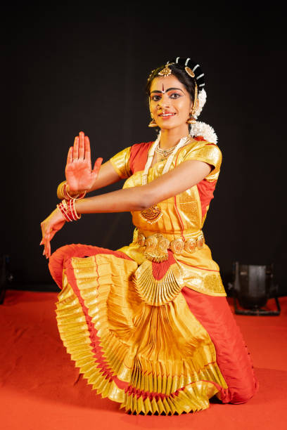 istock Traditional bharatanatyam dancer showing hand gesture or shiva pose on performance at stage - concept of mudra or asana, Indian culture and classic dancer 1375760186