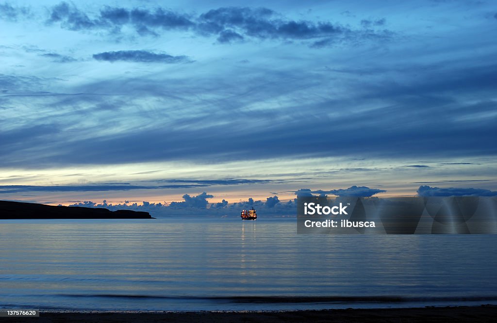 Fishing ship at night in northern Scotland (Highlands) Sea Stock Photo