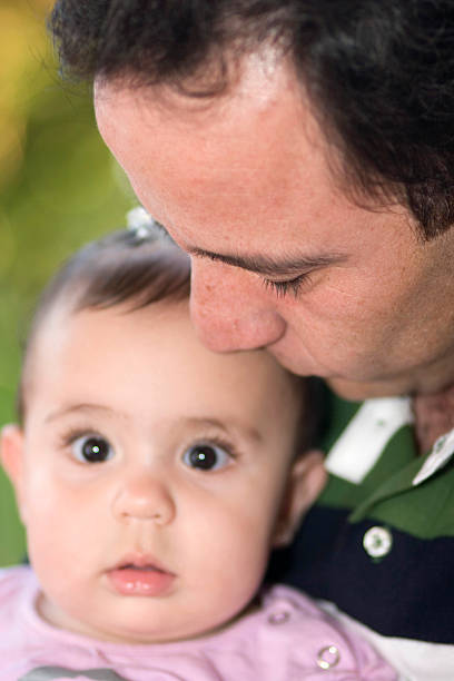 istock Beautiful Little Girl Playing With Dad 137578190