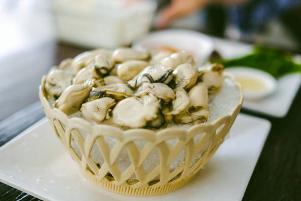 istock Oysters on the bowl and side dishes. 1375825073