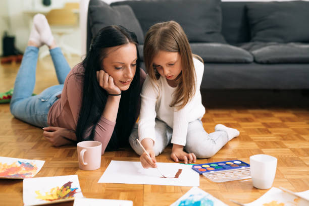 istock moter and daughter at home 1375855453