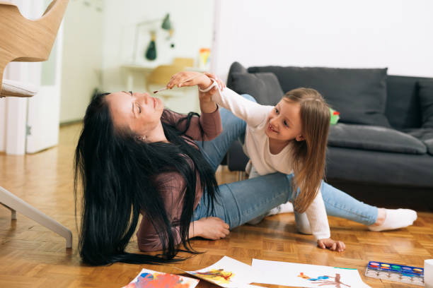 istock moter and daughter at home 1375856201