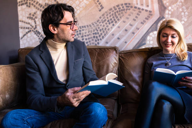 istock A man and a woman discussing a book 1375862468
