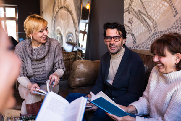 istock Book club members discussing a reading 1375862499