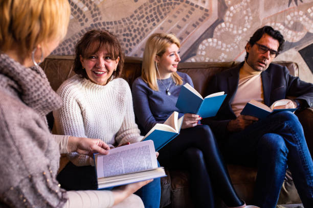 istock Book club members discussing a book 1375863067