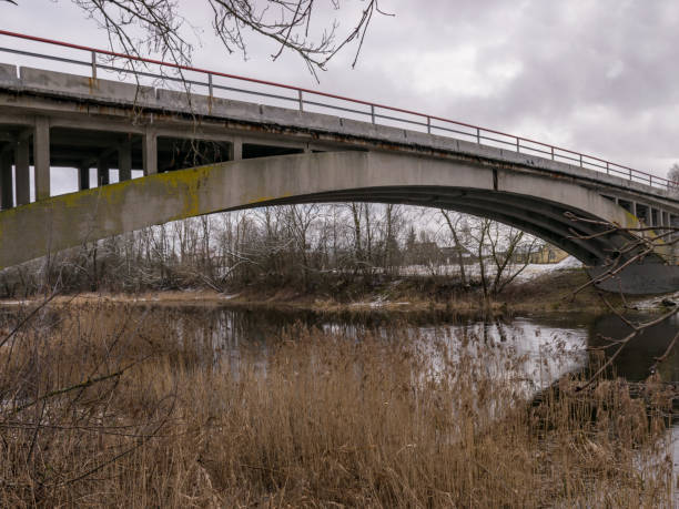 istock concrete arched bridge over a small and wild river 1375863070