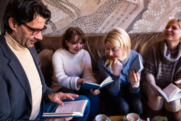 istock Mature adults reading in a book club 1375863584