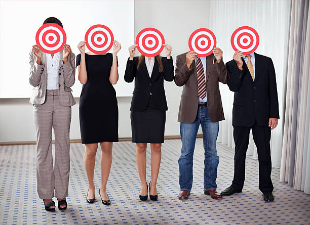 istock Group of business people holding a target 137587918