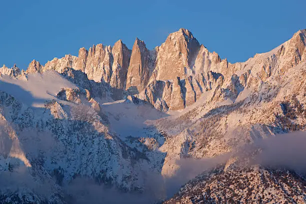 Winter landscape of Mt. Whitney, at sunrise with fog, Eastern Sierra Nevada Mountains, California, USA