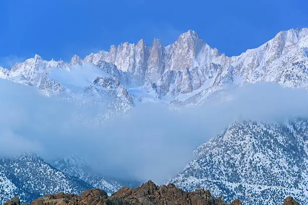 Winter landscape of Mt. Whitney, at dawn with fog, Eastern Sierra Nevada Mountains, California, USA