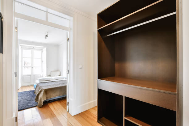 istock Luxury room design with large black wooden wardrobe 1375894178