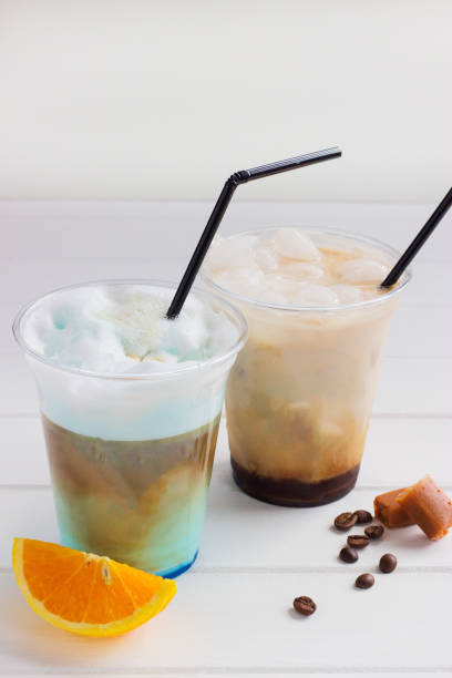 istock Milkshake ice coffee orange blue curacao white background plastic cup 1375898425