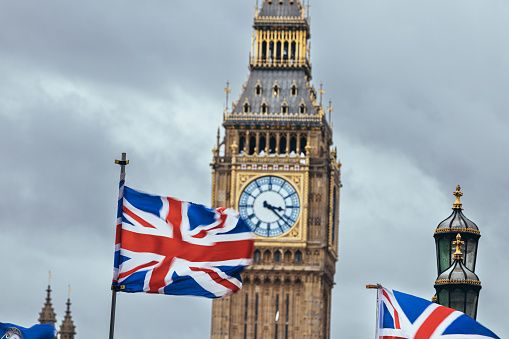 Union Jack flag and Big Ben in background at London Westminster, Platinum Jubilee