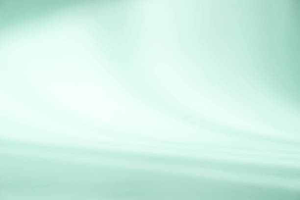 istock Abstract light green studio background for product presentation. Empty room with shadows of window. Display product with blurred backdrop. 1375903319