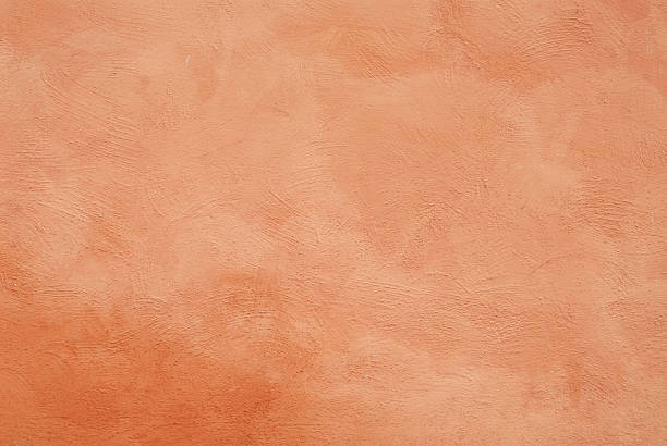 istock Orange stucco wall with brush strokes 137590738