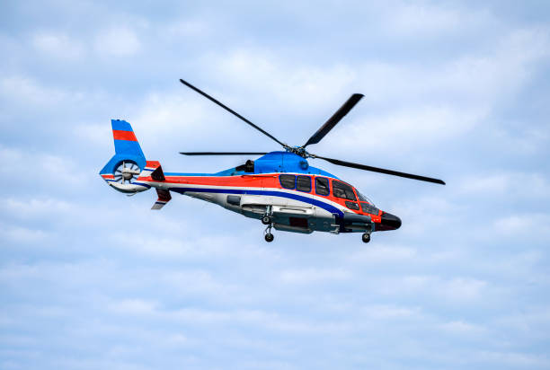 istock A helicopter flying in the sky. 1375921126