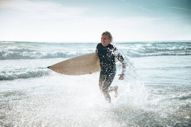 istock surfer man on manhattan beach california 1375928750