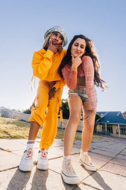 istock Two female youngsters making gestures outdoors 1375953177