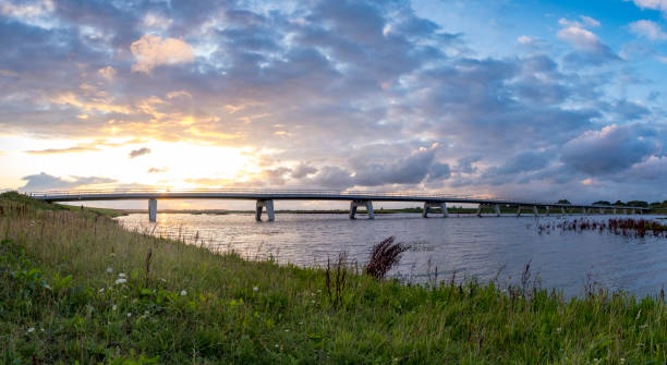 istock Summer sunset over a bridge in the IJsseldelta during a beautiful evening 1375965437