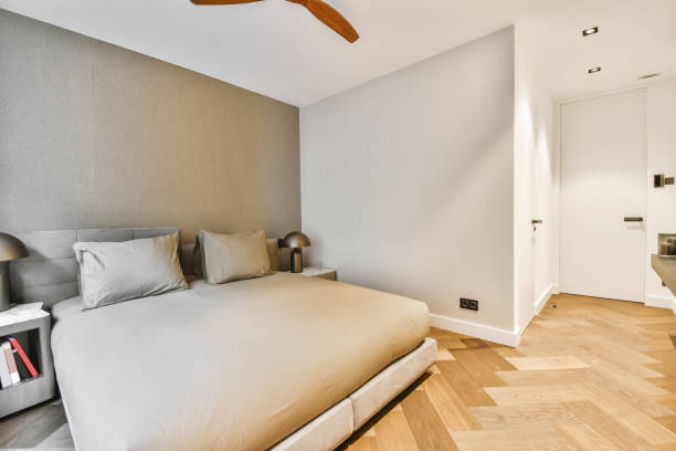 istock An attractive bedroom in a minimalist style with a soft double bed covered 1375967572