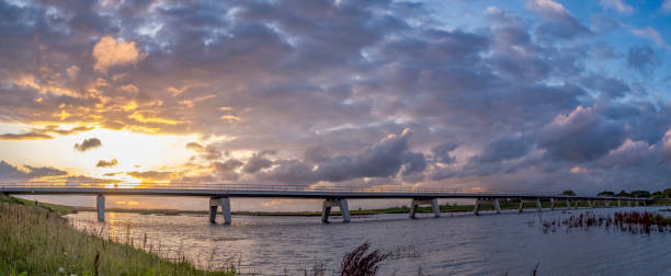 istock Summer sunset over a bridge in the IJsseldelta during a beautiful evening 1375972468