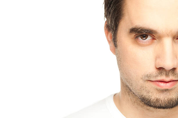 istock Young Man Against The Wall, Half Face 137597463
