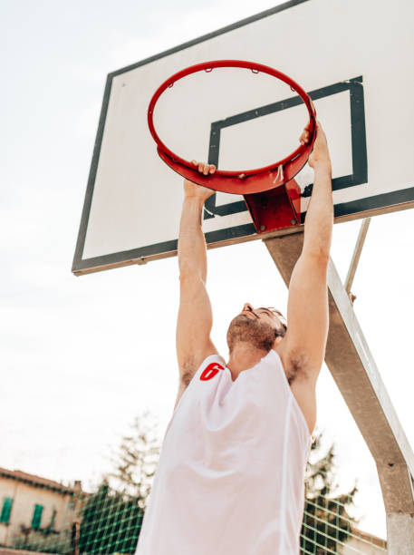 istock hanging to the basketball board 1375978582
