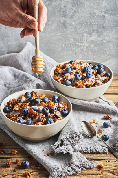 istock Healthy diet breakfast granola and blueberries with yogurt. 1375986025