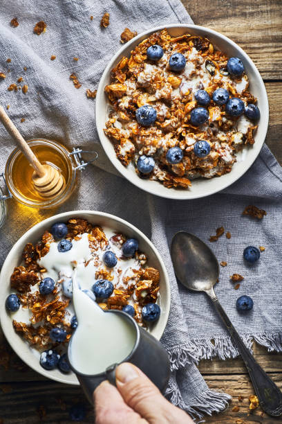 istock Healthy diet breakfast granola and blueberries with yogurt. 1375986605
