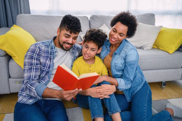 istock African-American family reading a book 1375992475