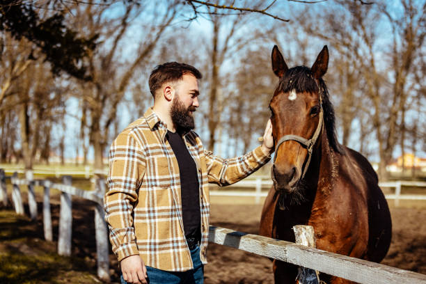istock Caucasian Men Spending His Free Time with Horse 1375999909