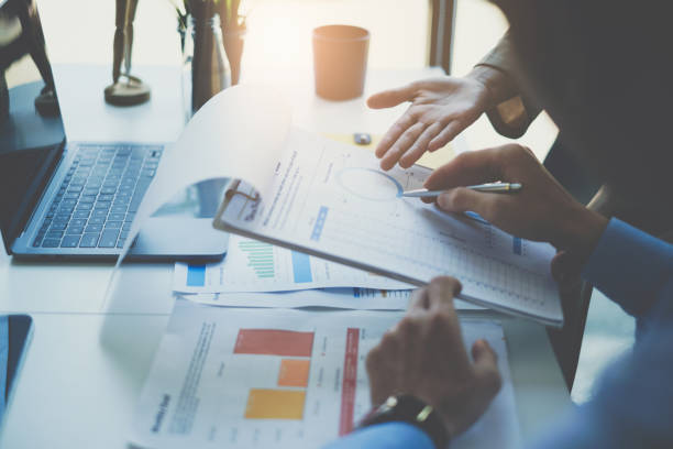 istock Analytics intelligence concept. Group of business people discuss current financial and economic on laptop for investment at the meeting. 1376005302