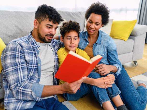 istock African-American family reading a book 1376006532