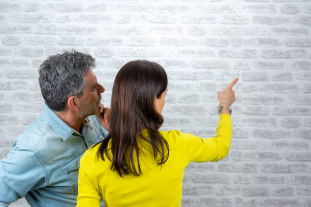 Man and woman in office discussing on something.