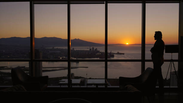 istock Business manager in the office during sunset 1376007382