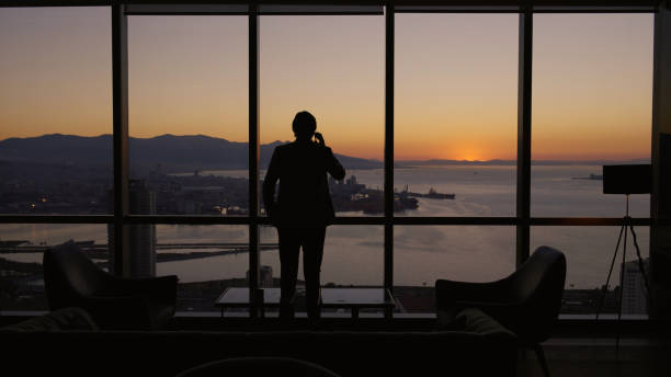 istock Business manager in the office during sunset 1376007993
