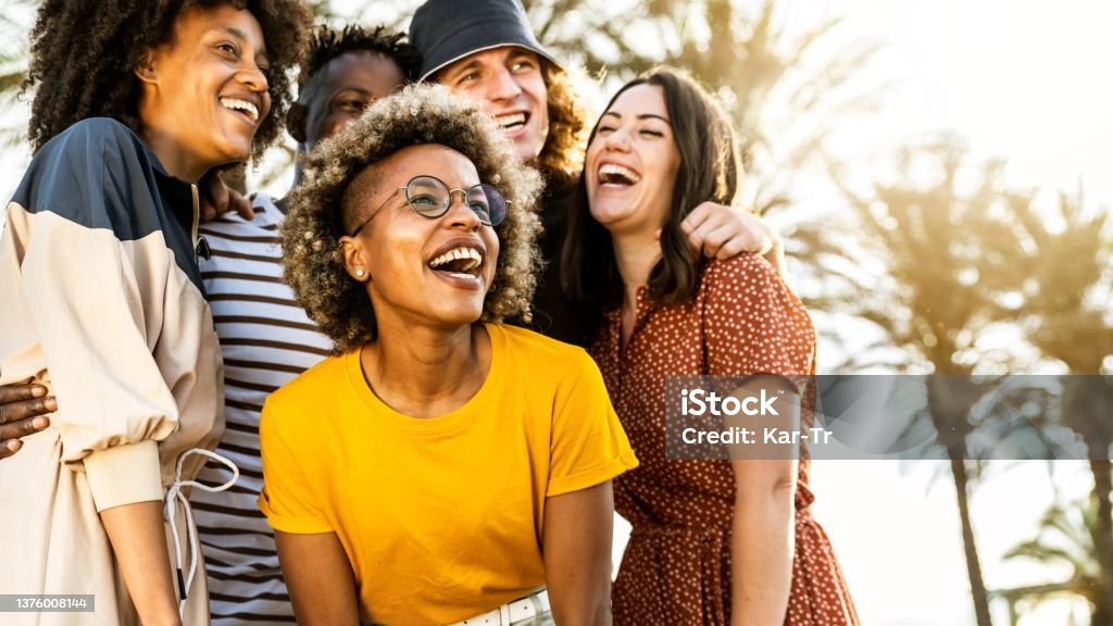 Young people laughing out loud on a sunny day - Cheerful group of best friends enjoying summer vacation together - Human resources, youth lifestyle and summertime holidays concept young people laughing out loud on a sunny day - Cheerful group of best friends enjoying summer vacation together - Human resources, youth lifestyle and summertime holidays concept Friendship Stock Photo
