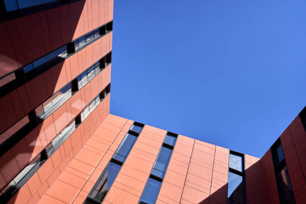 istock clear sky and modern building, seen from below 1376008609
