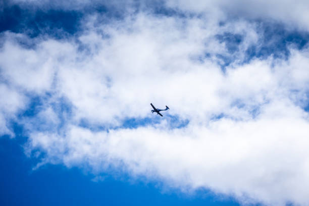 Private plane flying in good weather. Blue Sky background