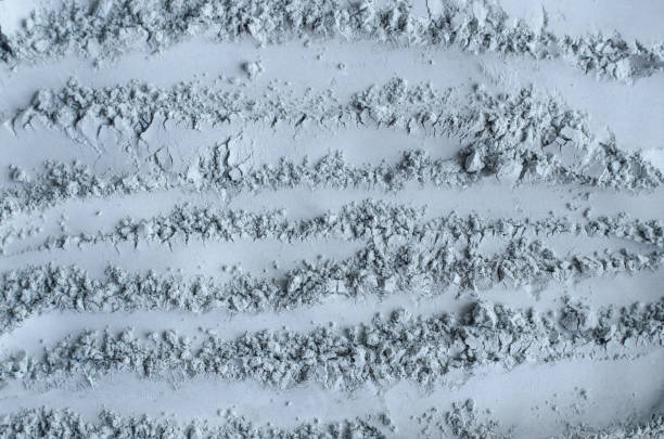 istock Gray, blue bentonite clay powder (alginate, facial mask, eye shadow, body wrap) texture close up, selective focus. Abstract background. 1376035578