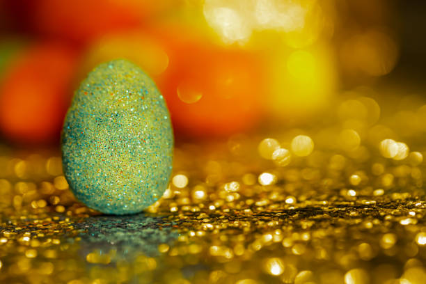 Multi colored Easter eggs lying down on the artificial grass. Shallow depth of field. High resolution - 50 megapixels.